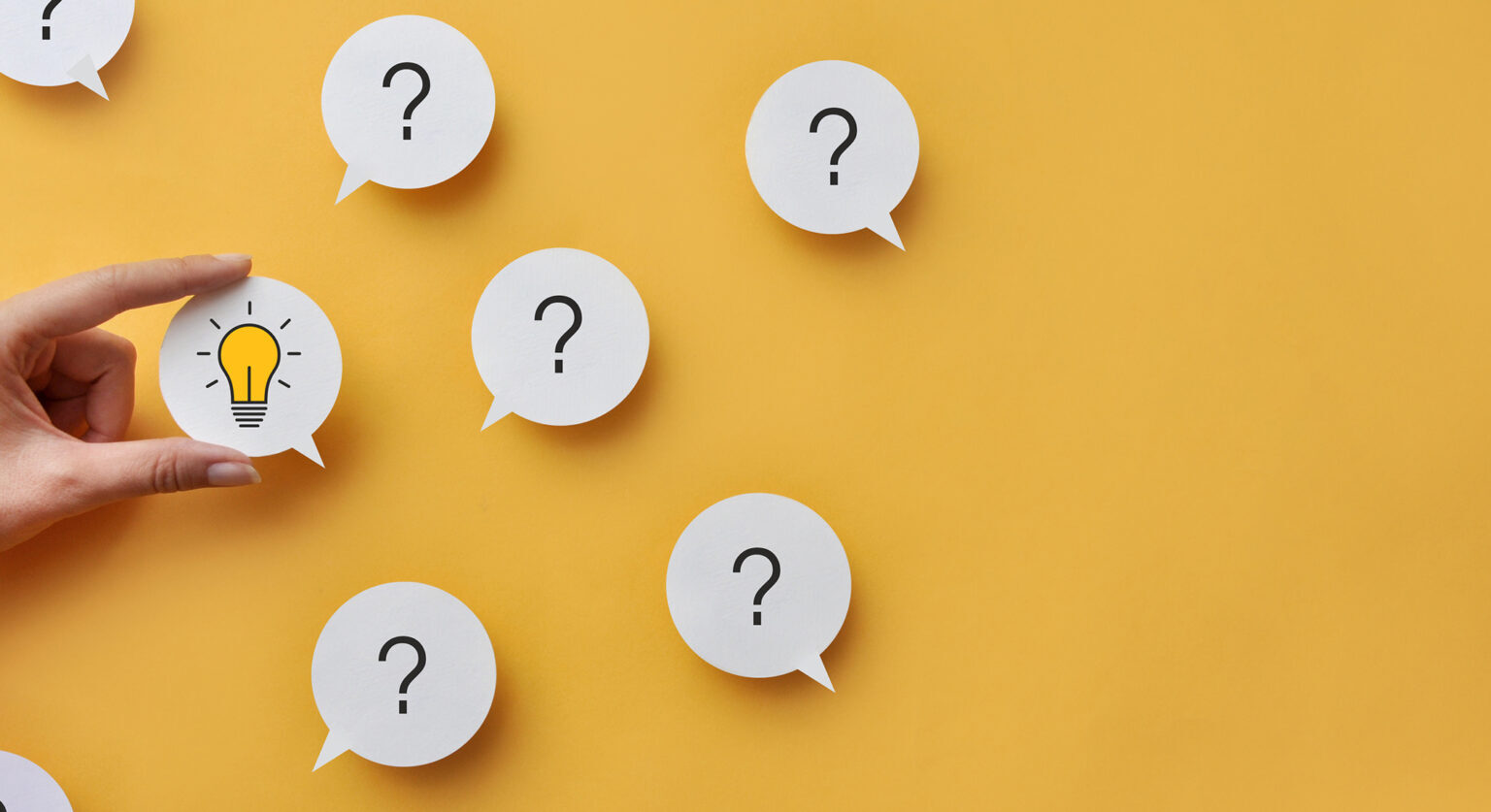Question marks in speech bubbles and speech bubble with a lightbulb inside