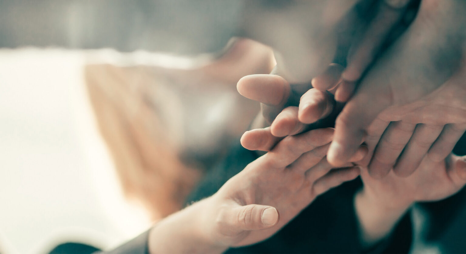 Hands put together in a huddle