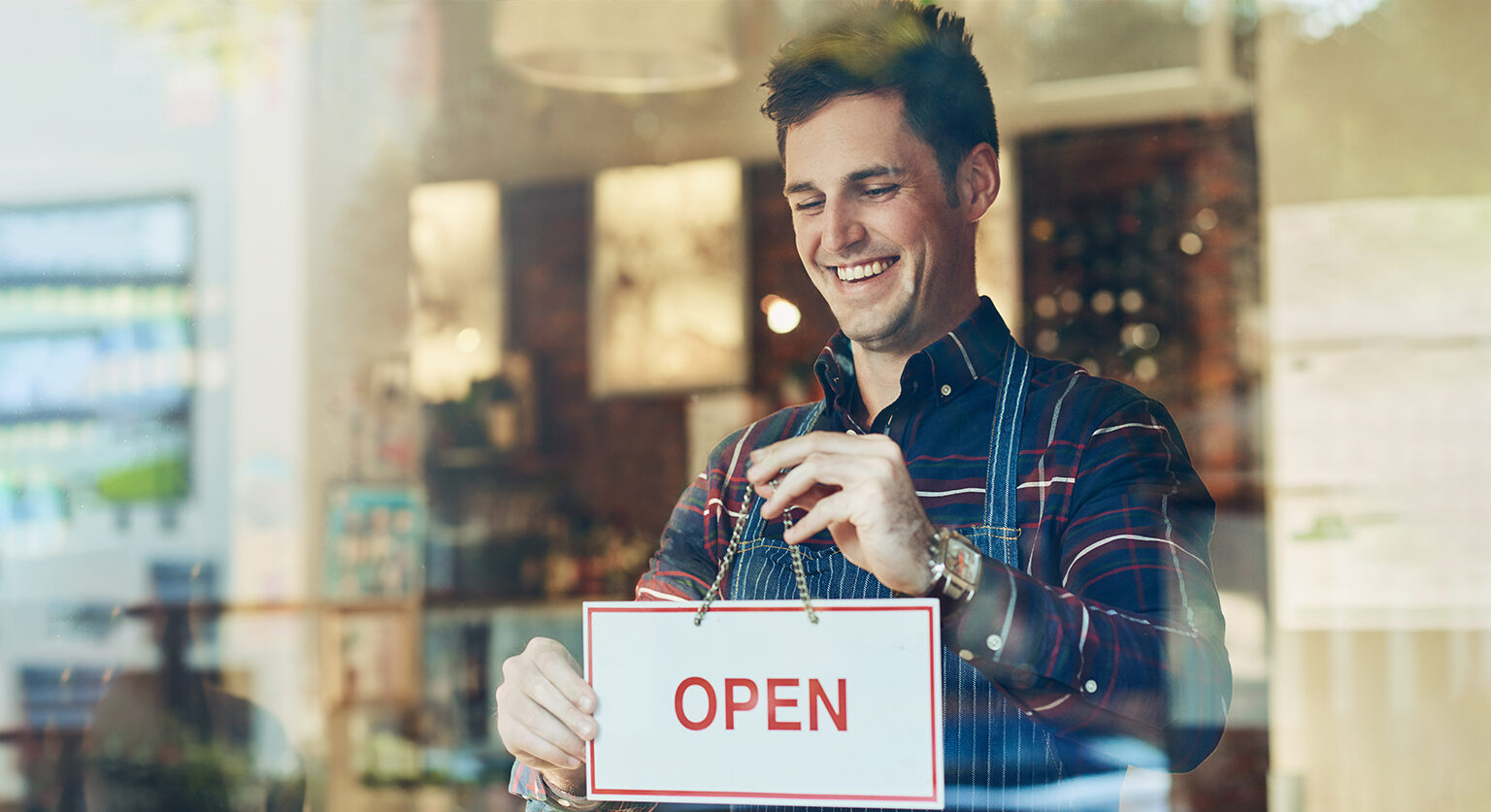 Man in a shop putting the 