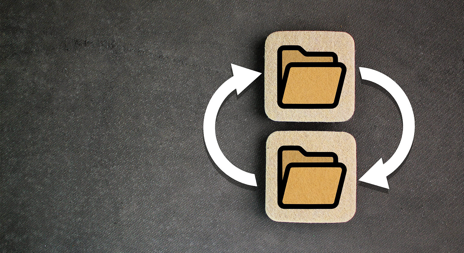 Two file folders, one on top of another, and two arrows pointing each way between them