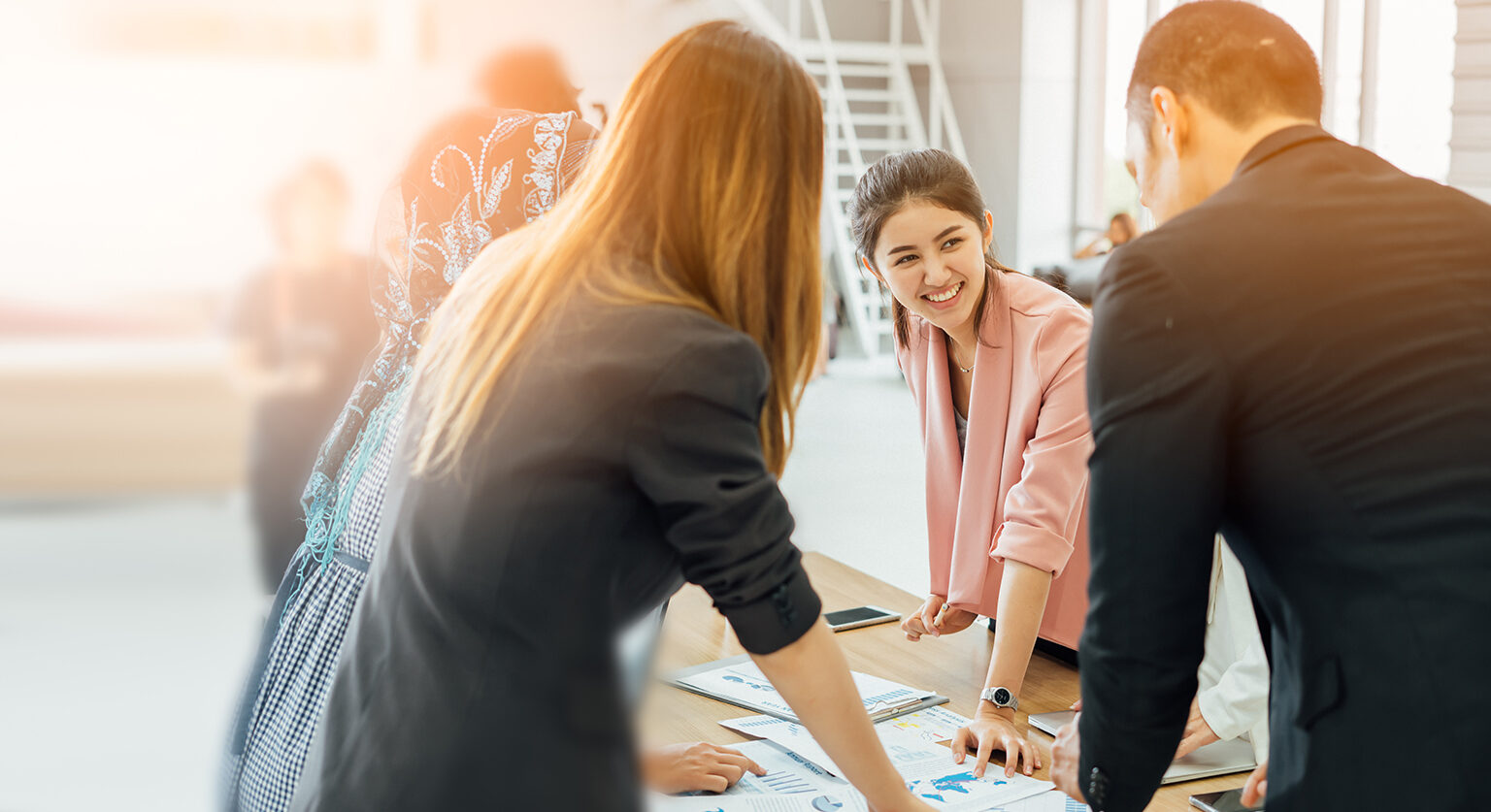 People in an office laughing together